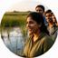 Priya Nair speaking with volunteers beside a restored wetland